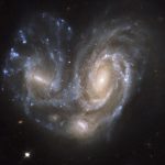 Orbiting galaxies. Okay, colliding really. NGC 6050 by Hubble